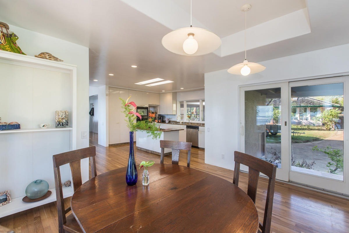 5040 Aliomanu Road Kilauea, HI 96754 - Photo 13 of 23 a dining room with furniture and wooden floor
