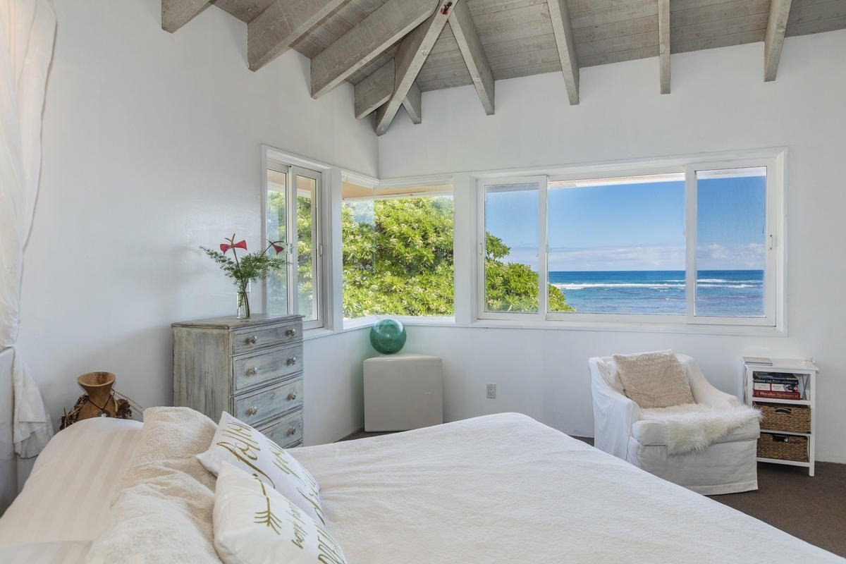 5040 Aliomanu Road Kilauea, HI 96754 - Photo 19 of 23 a bedroom with a bed and a window