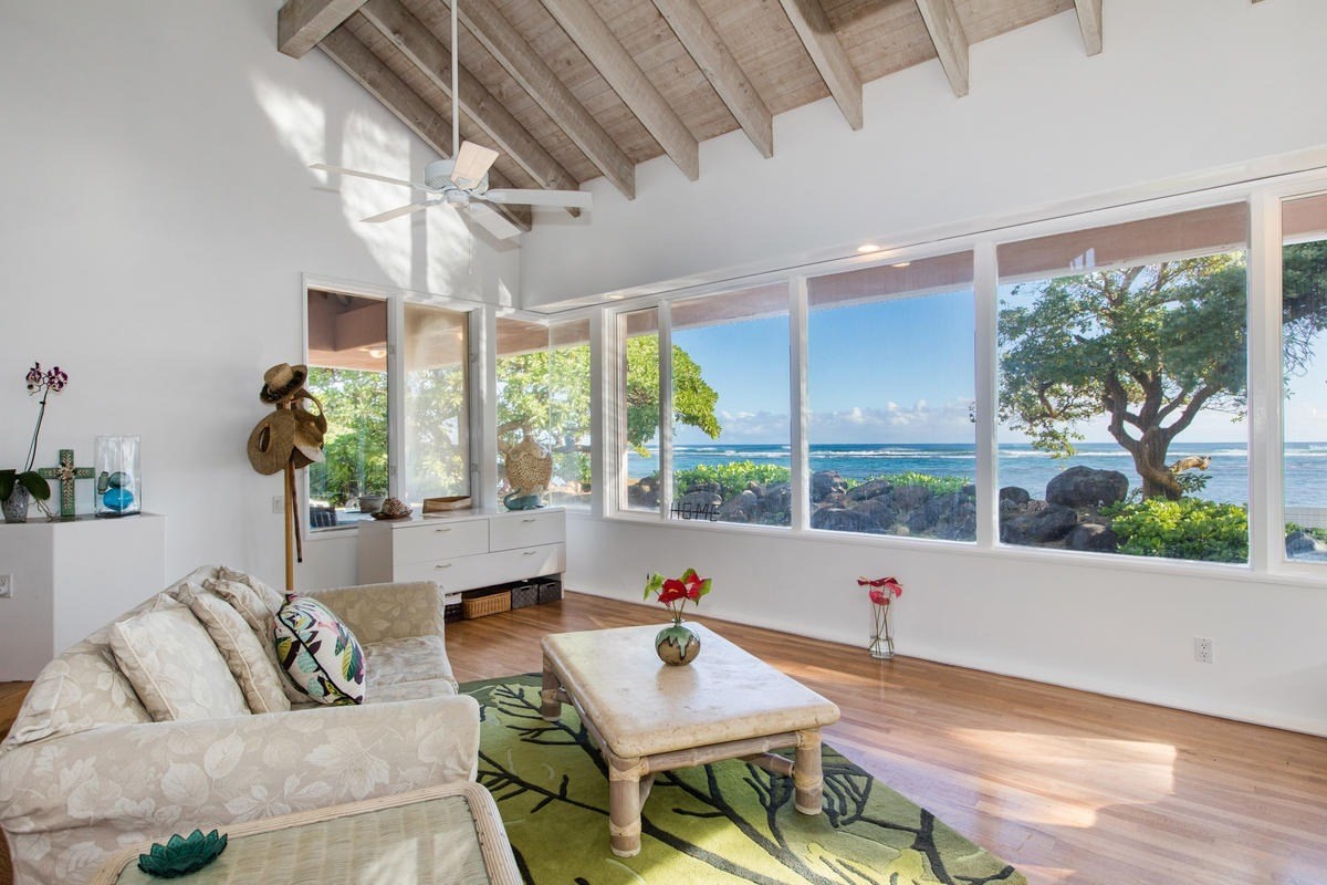 5040 Aliomanu Road Kilauea, HI 96754 - Photo 2 of 23 a living room with furniture and a large window