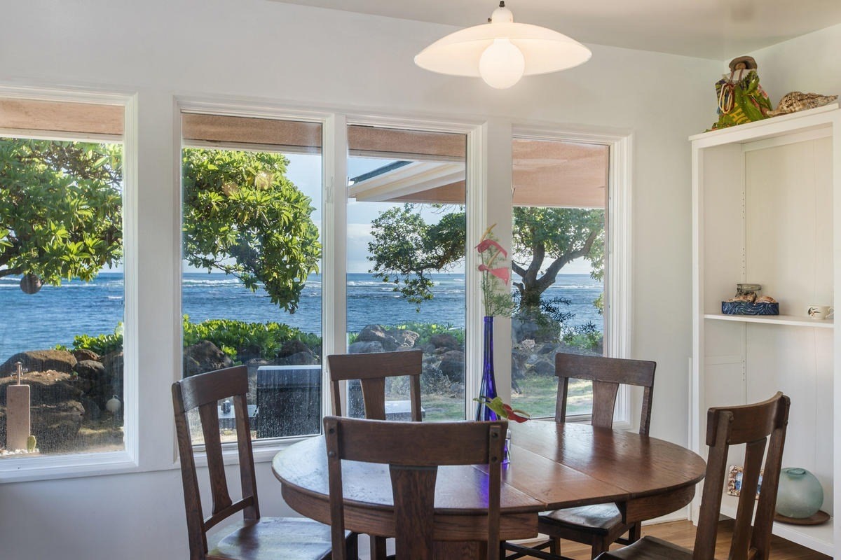 5040 Aliomanu Road Kilauea, HI 96754 - Photo 4 of 23 a view of a dining room with furniture window and outside view