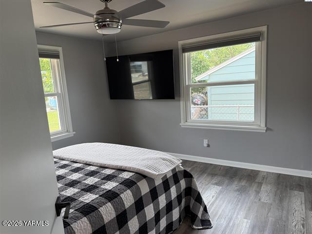815 Ellen Avenue Prosser, WA 99350 - Photo 12 of 16 a bedroom with a bed and a window