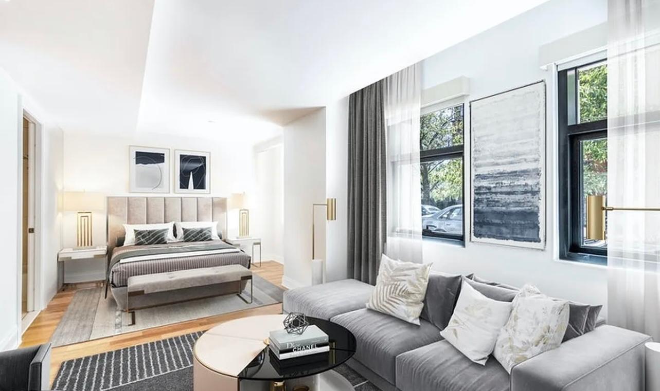 170 East End Avenue, Unit 1D Manhattan, NY 10128 - Photo 5 of 8 a living room with furniture and a window