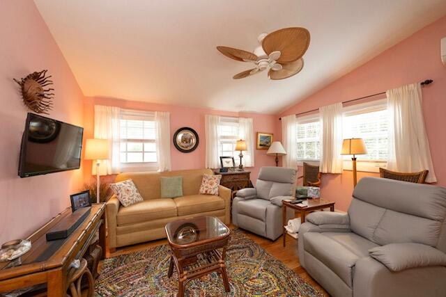 1218 Packer Street, Unit REAR Key West, FL 33040 - Photo 8 of 22 a living room with furniture a flat screen tv and a window