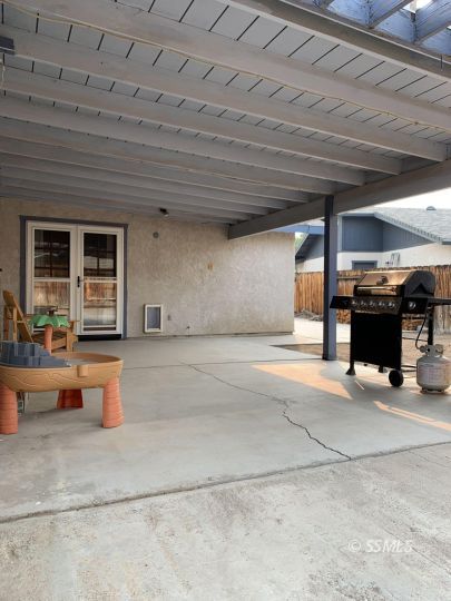 807 James Street Ridgecrest, CA 93555 - Photo 34 of 37 a view of a patio with table and chairs