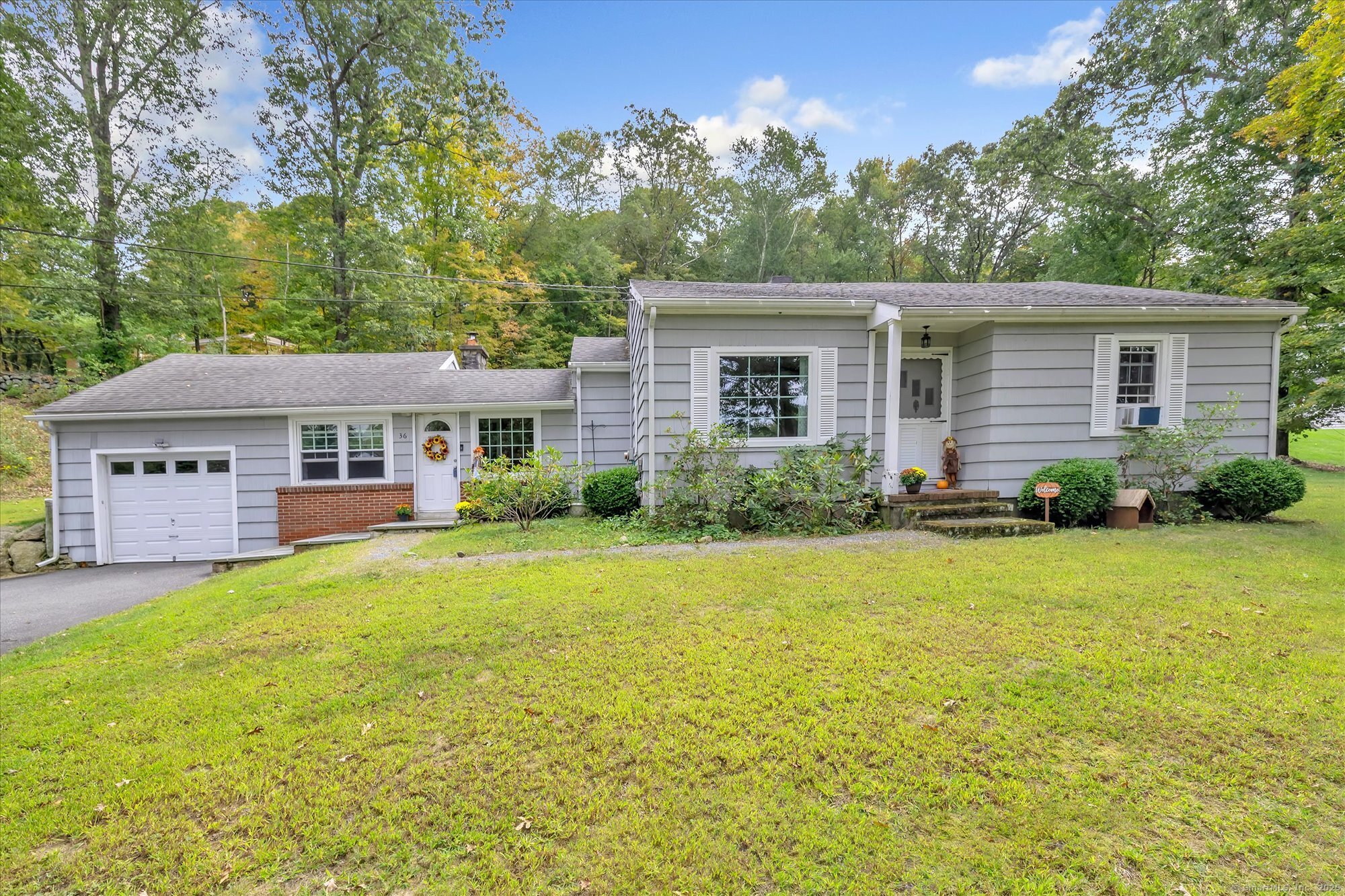 front view of a house with a yard