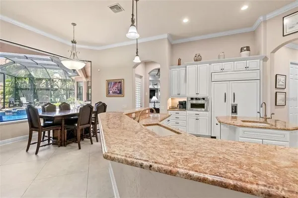 a living room with furniture a fireplace and a large window