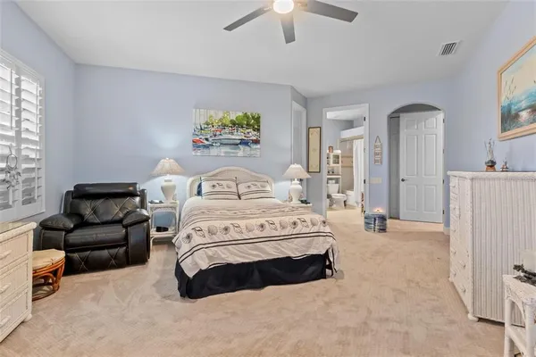 a view of swimming pool with sitting area