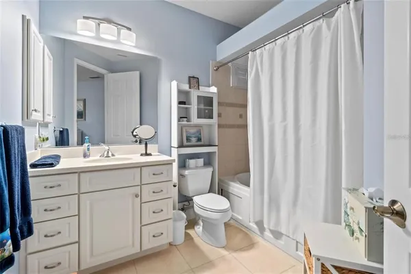 a front view of a house with garden and porch