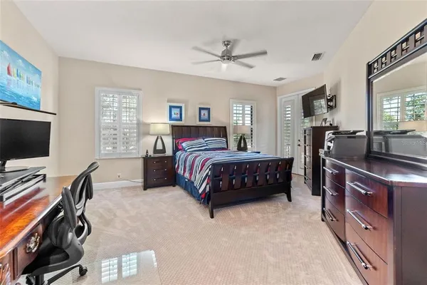 an aerial view of a house with a garden and lake view