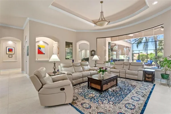 a living room with furniture fireplace and window