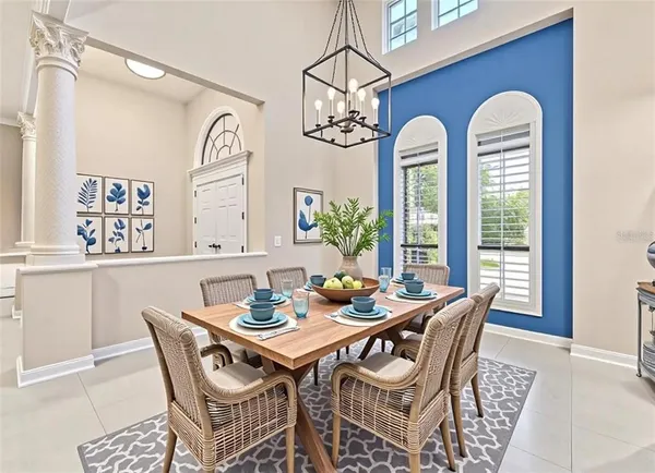 a kitchen with granite countertop a sink a counter space appliances and cabinets