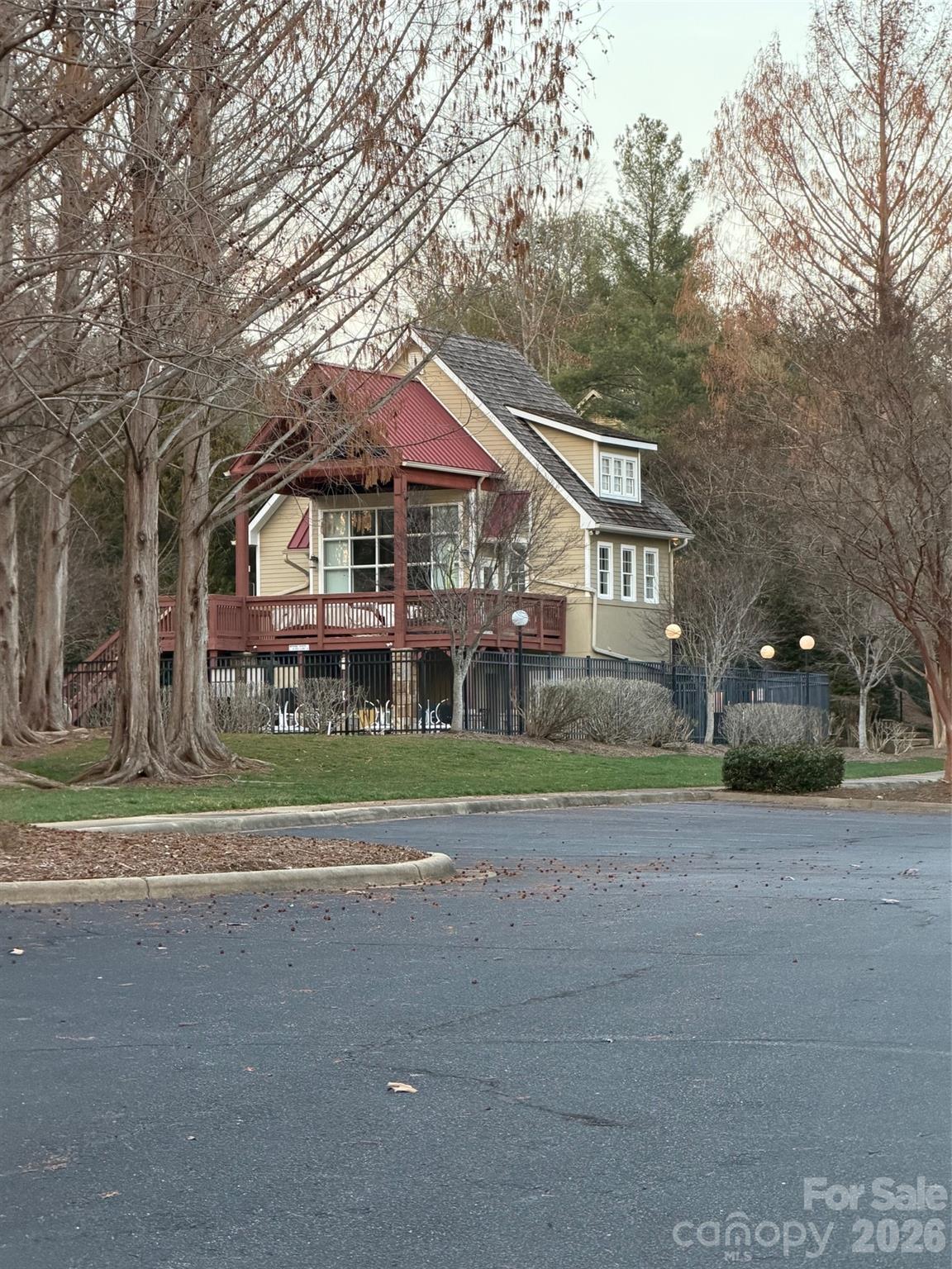 1388 Old Dry Creek Road Morganton, NC 28655 - Photo 25 of 39 a front view of a house with a yard and potted plants