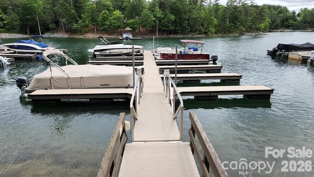 1388 Old Dry Creek Road Morganton, NC 28655 - Photo 3 of 39 a view of a lake with boats and trees in the background