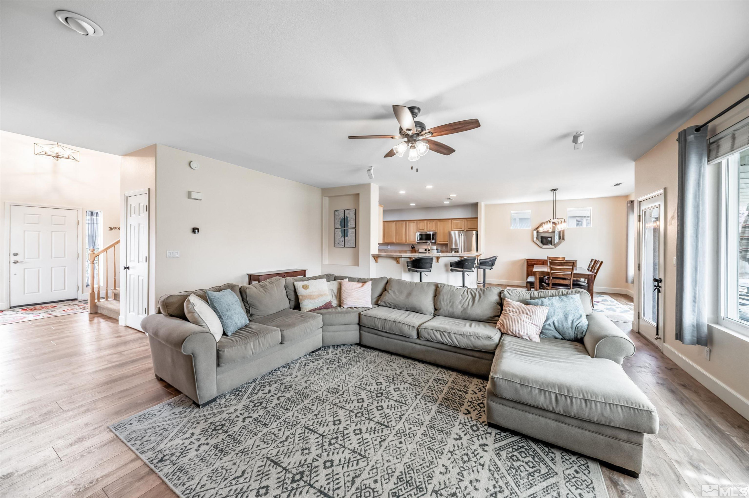 9915 Bandana Way Reno, NV 89521 - Photo 11 of 40 a living room with furniture and a large window