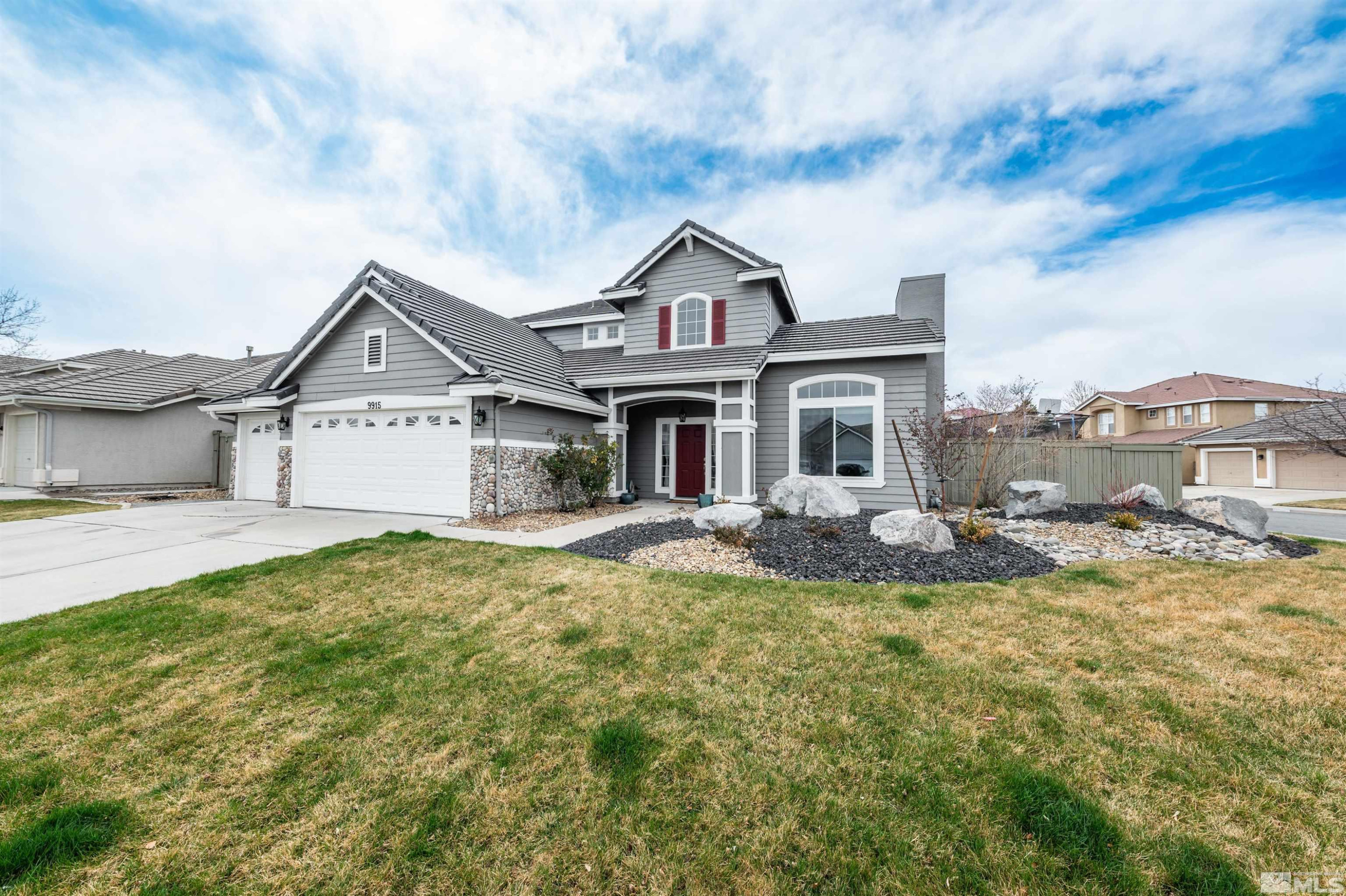 9915 Bandana Way Reno, NV 89521 - Photo 2 of 40 a view of a house with a big yard and large tree
