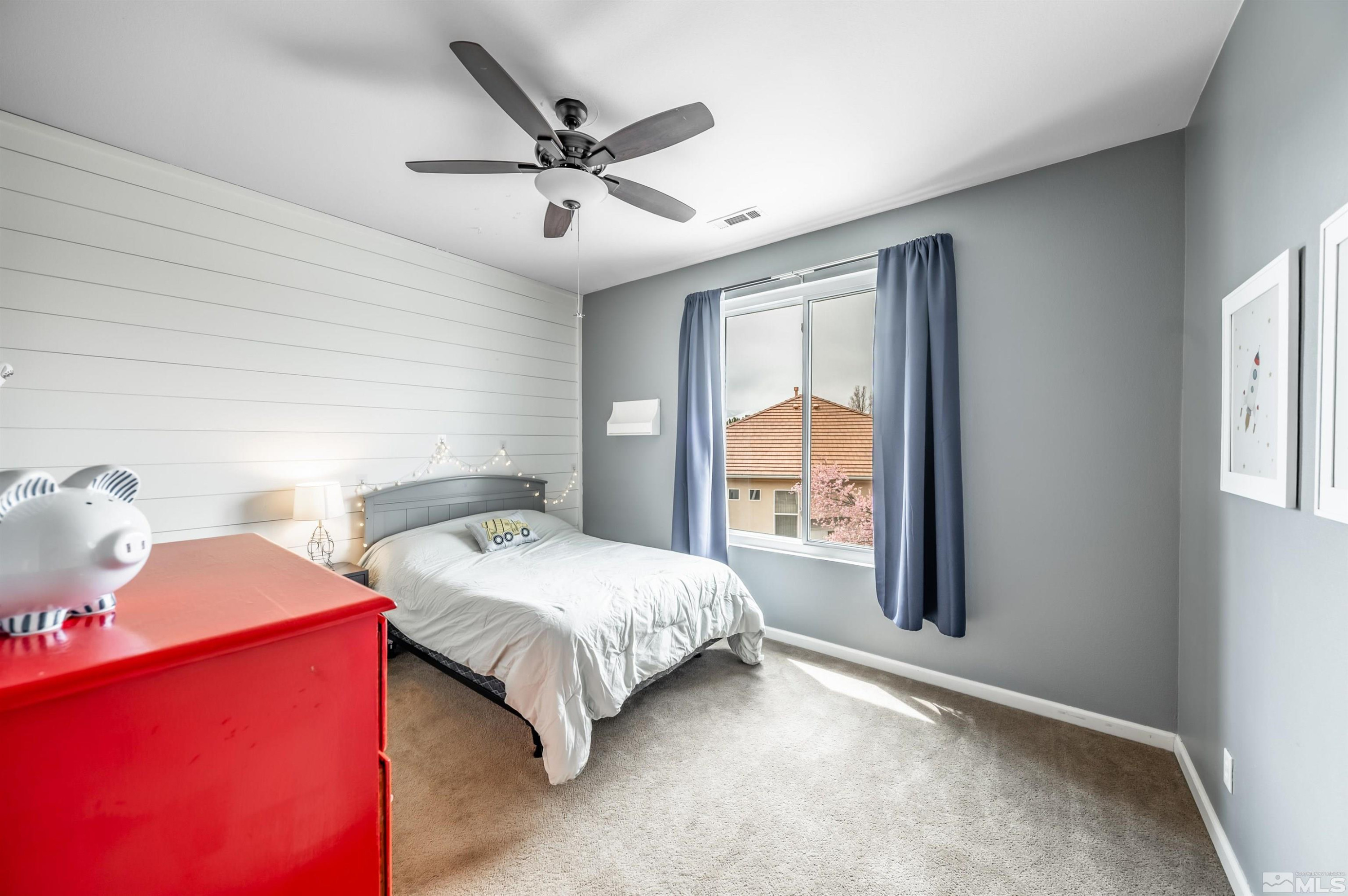 9915 Bandana Way Reno, NV 89521 - Photo 29 of 40 a bedroom with a bed and a large window