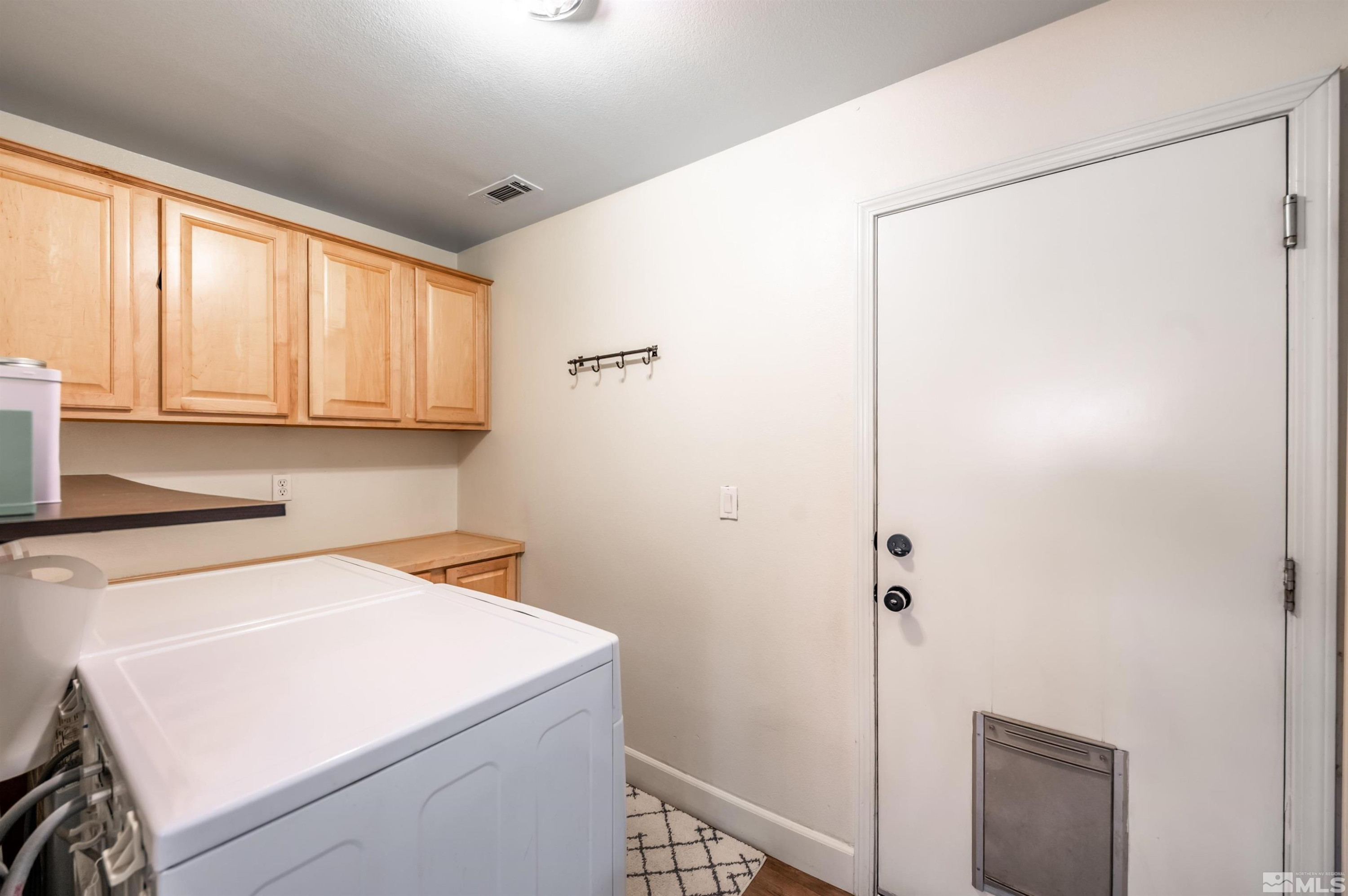 9915 Bandana Way Reno, NV 89521 - Photo 32 of 40 a utility room with dryer and washer