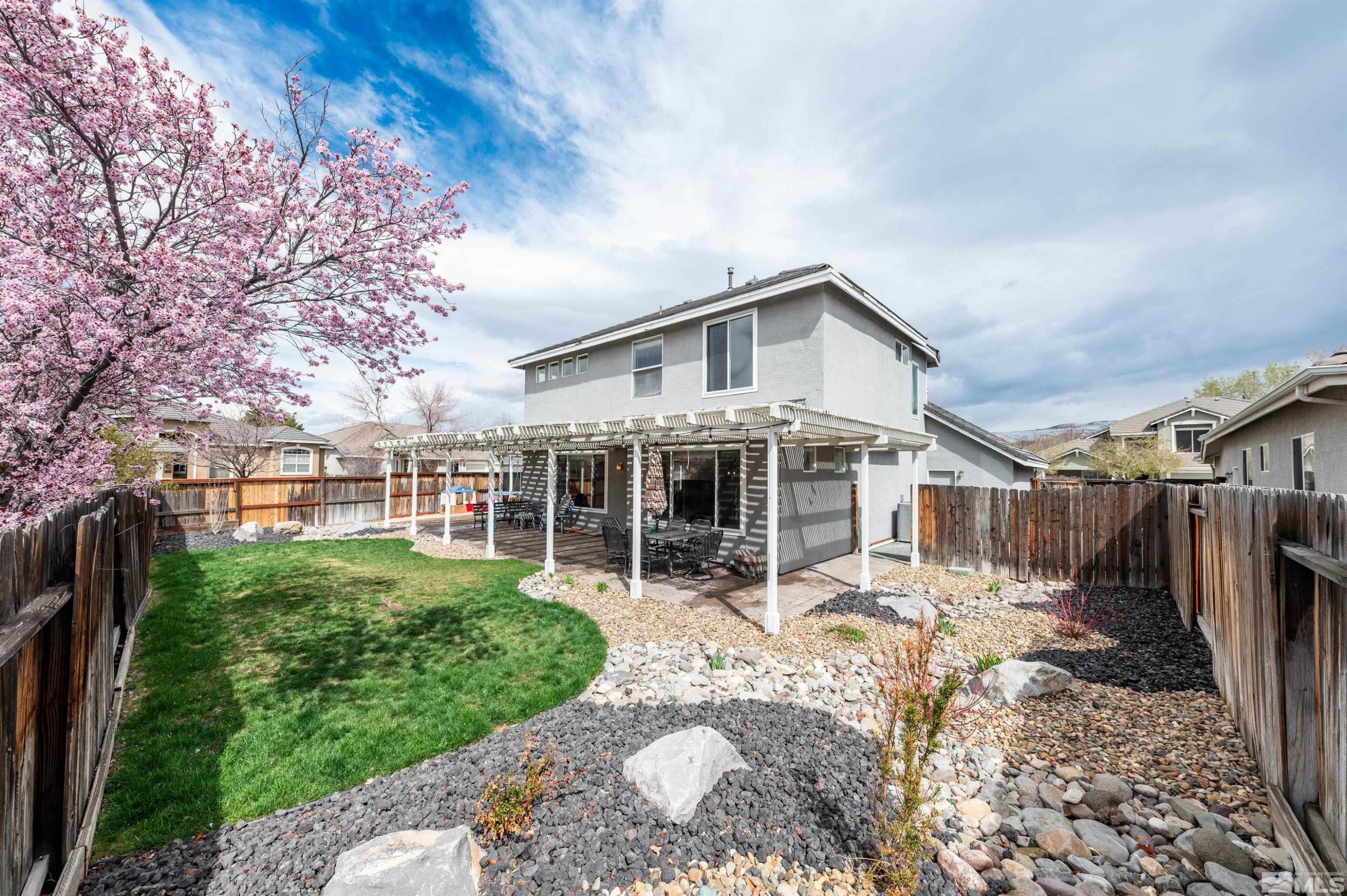9915 Bandana Way Reno, NV 89521 - Photo 34 of 40 a view of a house with a yard in front of it