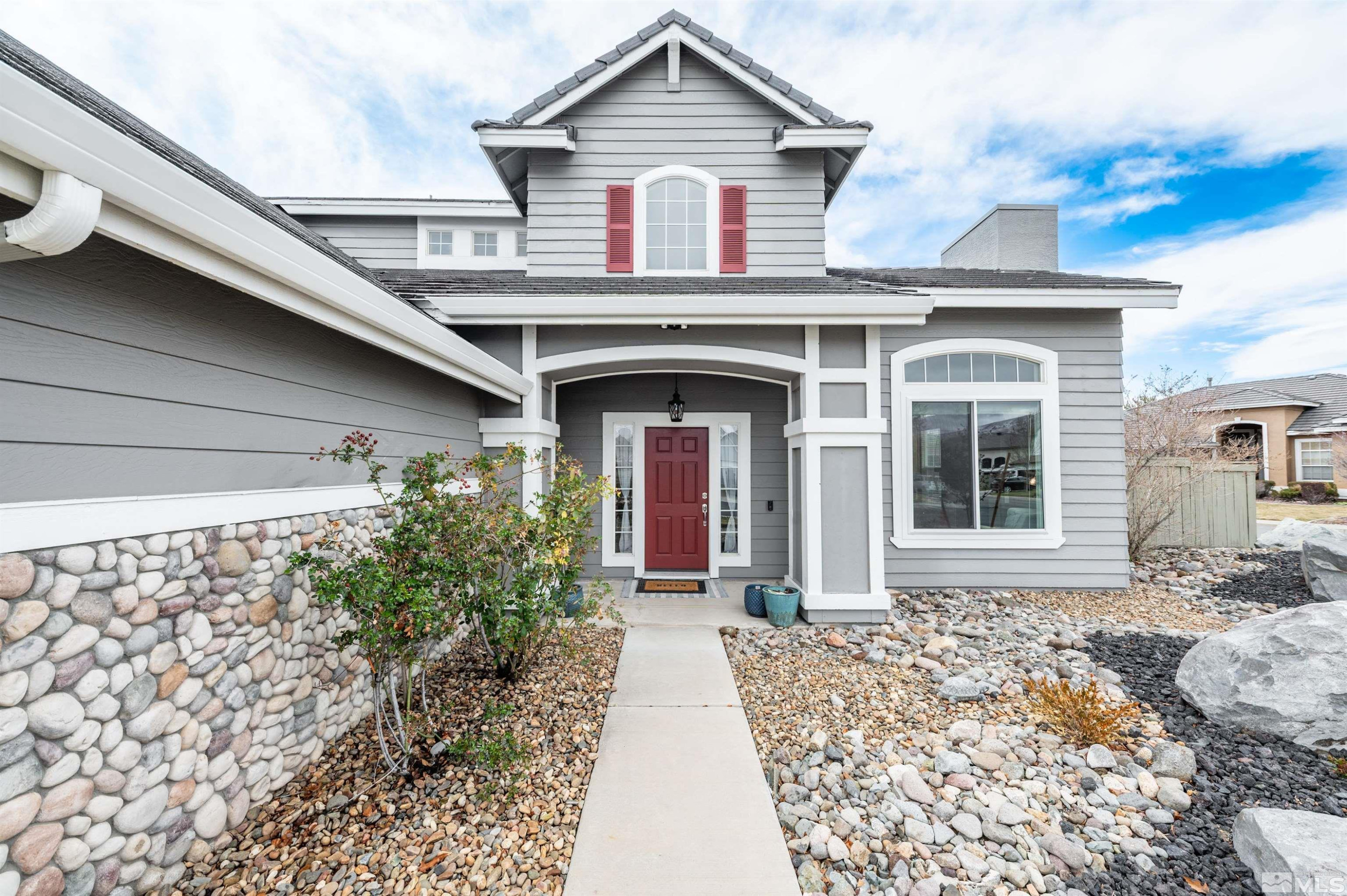 9915 Bandana Way Reno, NV 89521 - Photo 4 of 40 a front view of a house with garden