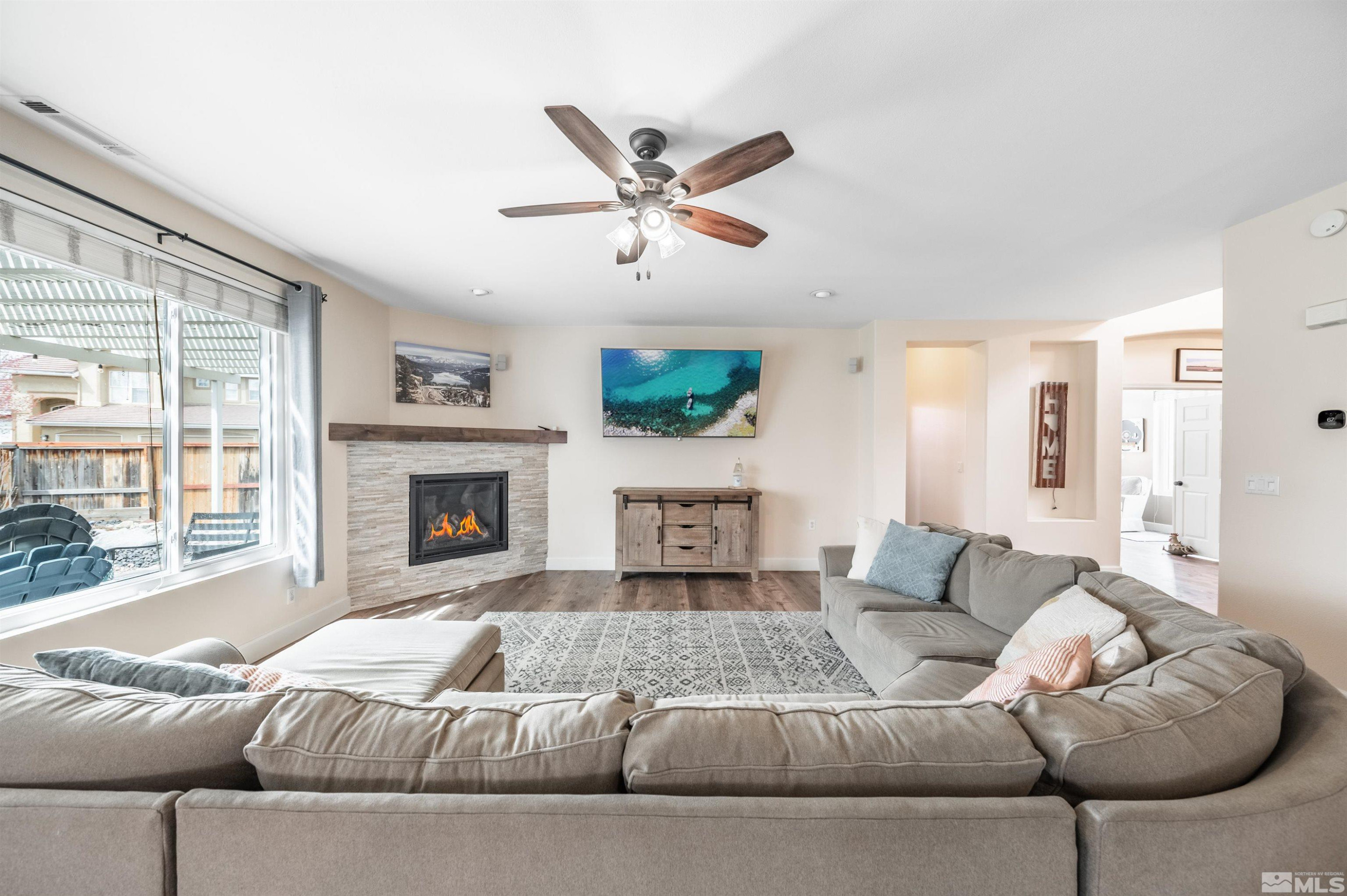 9915 Bandana Way Reno, NV 89521 - Photo 9 of 40 a living room with furniture and a fireplace