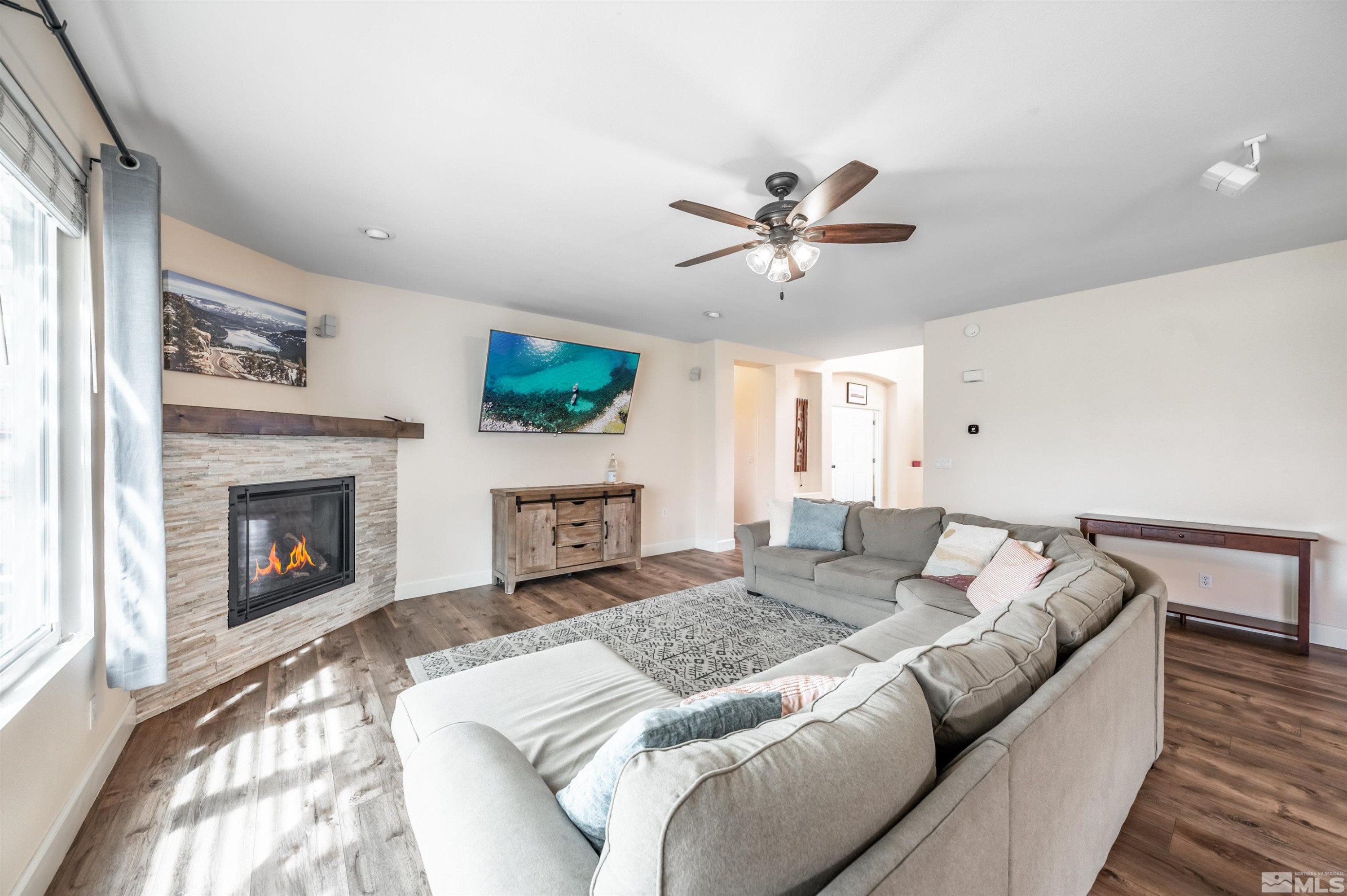 9915 Bandana Way Reno, NV 89521 - Photo 10 of 40 a living room with furniture and a fireplace