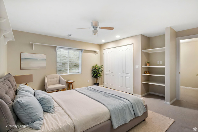 1417 Blacksmith Lane Draper, UT 84020 - Photo 32 of 57 Carpeted interior space featuring a window with blinds, a ceiling fan, recessed lighting, built-in shelving, and bifold closet doors