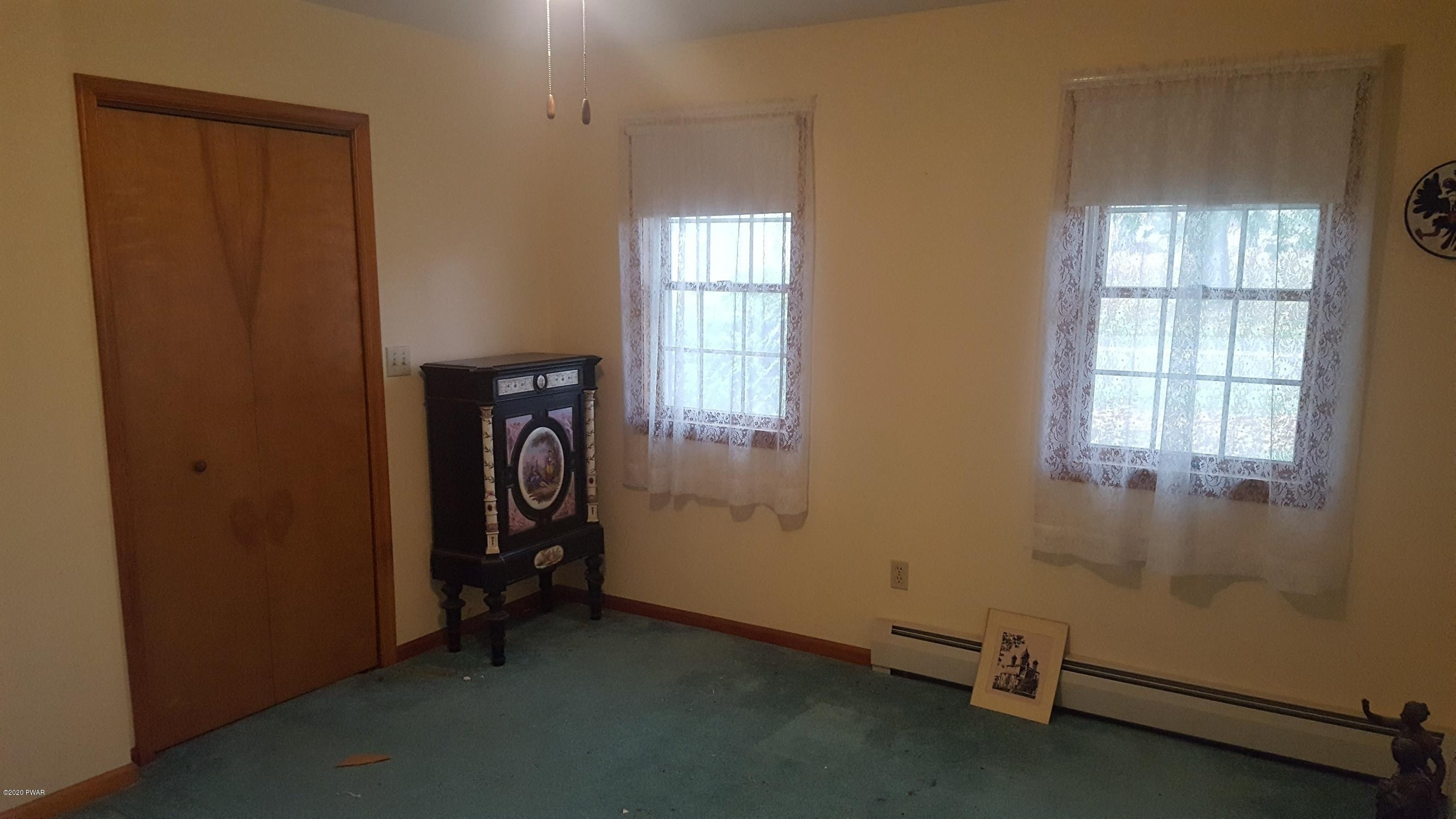 554 St Tikhons Road Waymart, PA 18472 - Photo 9 of 29 an empty room with windows