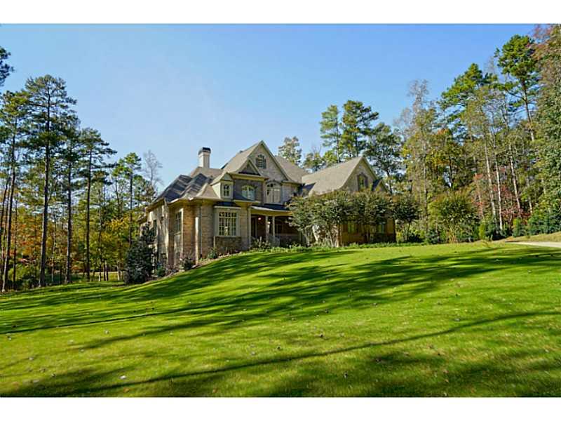 Exterior Front. Amazing French country estate home situated on a private 4.8+ acre lake front lot. Extremely private, but conveniently located to Milton, top rated schools and shopping.