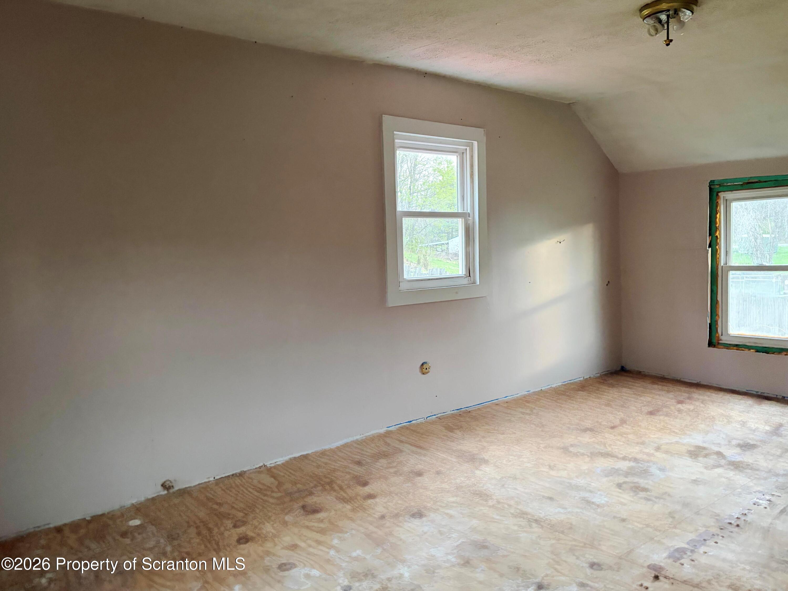 2466 State Rte 4002 Mehoopany, PA 18629 - Photo 8 of 11 an empty room with windows