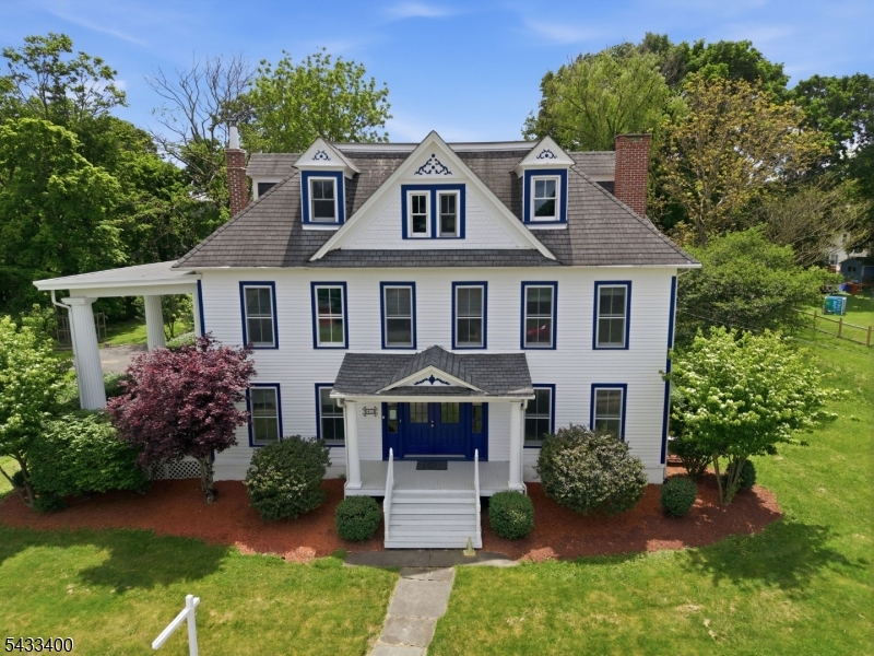 61 New Street Hampton, NJ 08827 - Photo 3 of 45 a front view of a house with a garden and plants