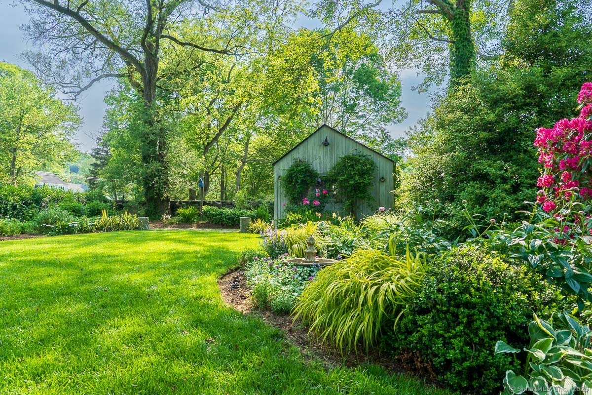 105 River Road Groton, CT 06355 - Photo 13 of 39 a view of a garden with plants