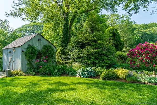 a view of a backyard with garden