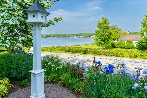 a view of a pathway in front of house with a yard