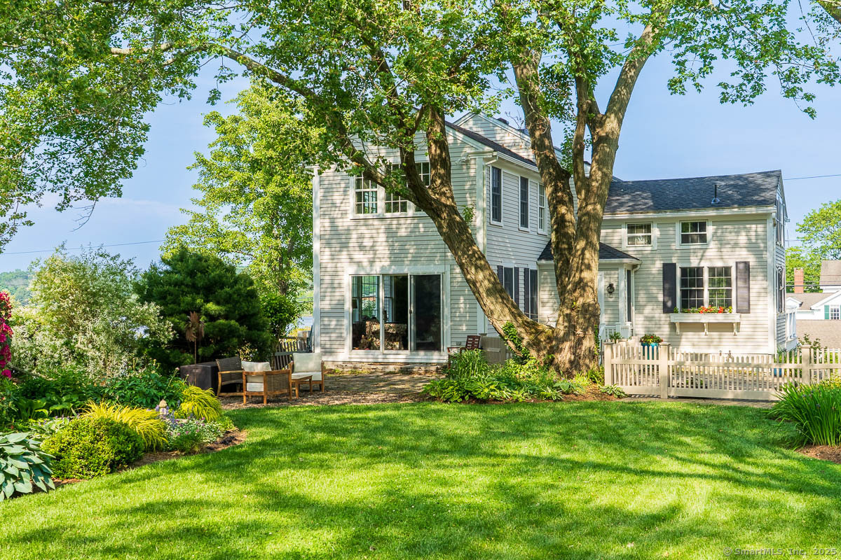 105 River Road Groton, CT 06355 - Photo 3 of 39 a view of a house with backyard and sitting area