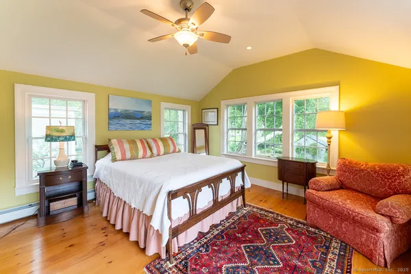 a bedroom with a bed and a couch