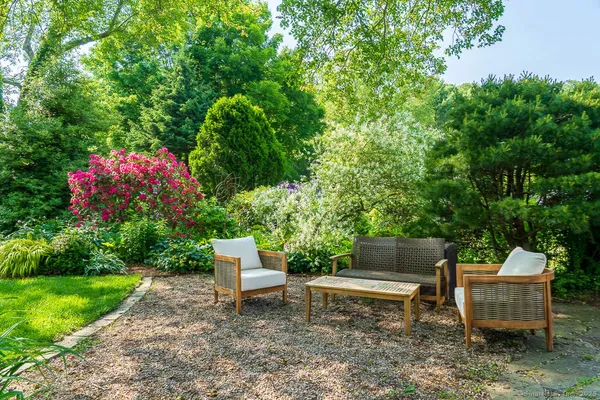 a garden view with a seating space