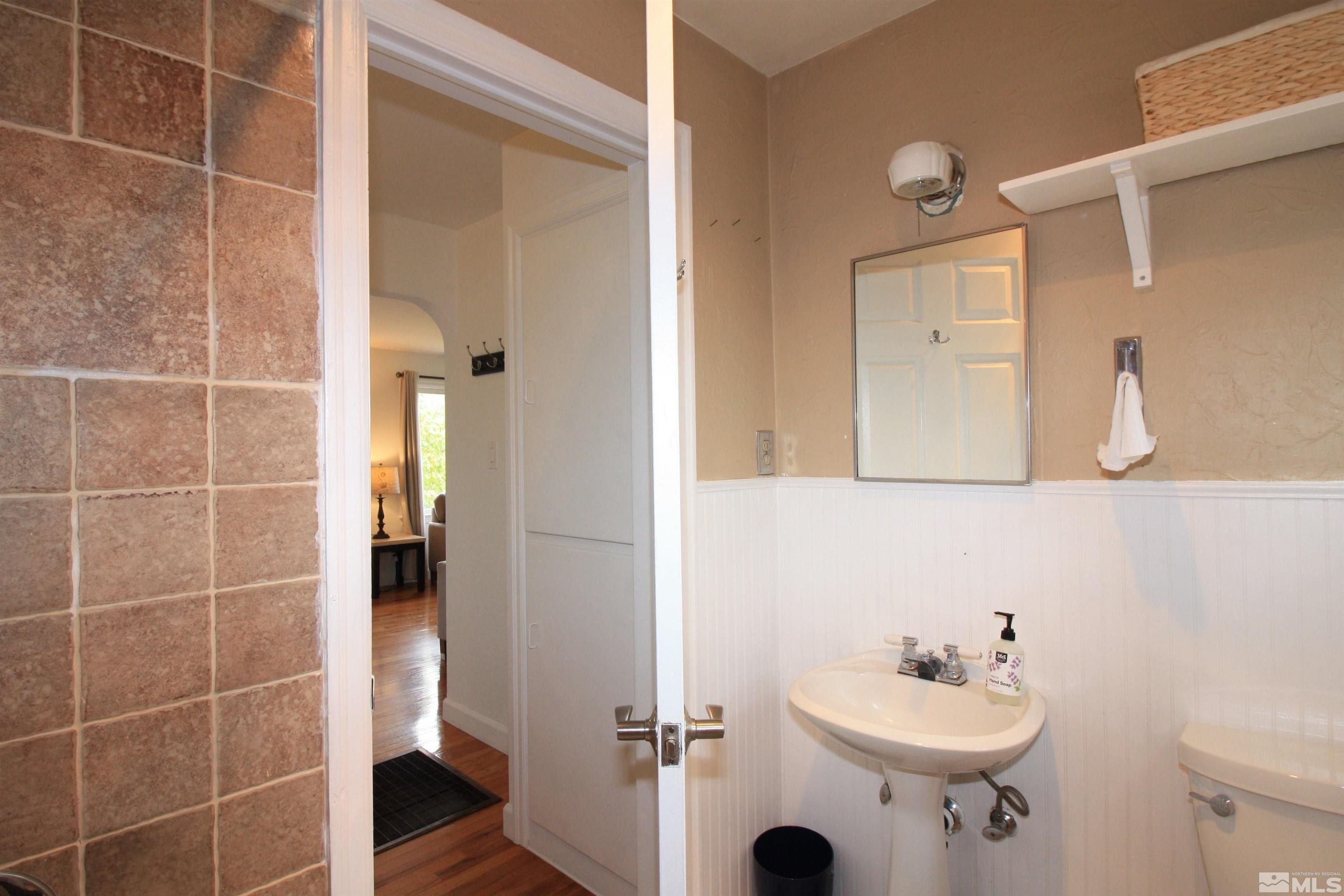 540 Toiyabe Street Reno, NV 89509 - Photo 13 of 29 a bathroom with a sink toilet and shower