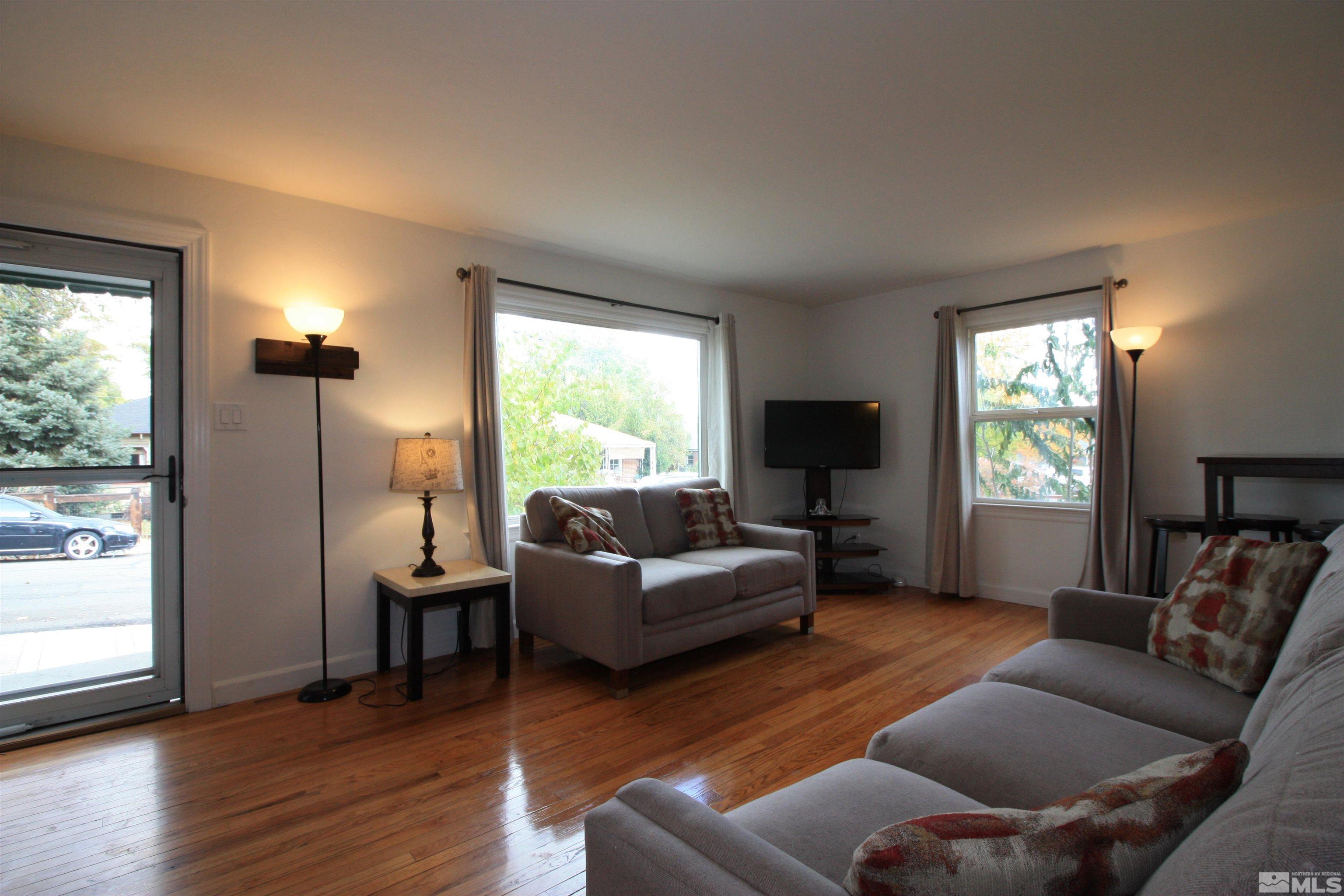 540 Toiyabe Street Reno, NV 89509 - Photo 4 of 29 a living room with furniture and a flat screen tv