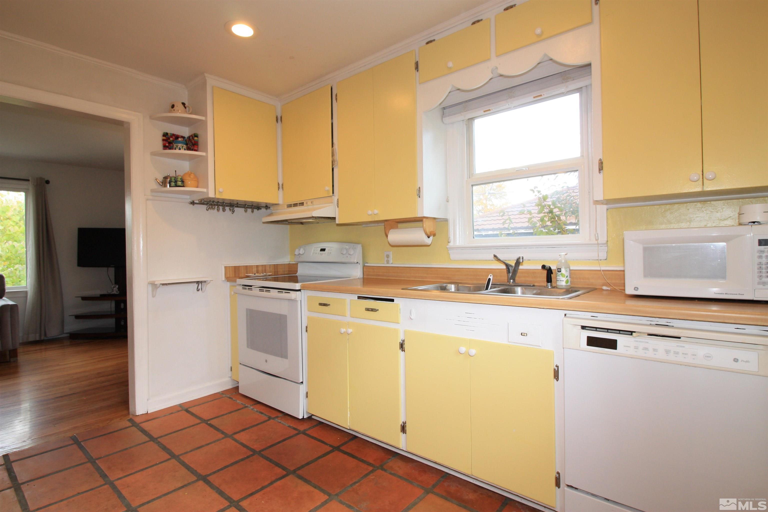 540 Toiyabe Street Reno, NV 89509 - Photo 7 of 29 a kitchen with a sink cabinets and window
