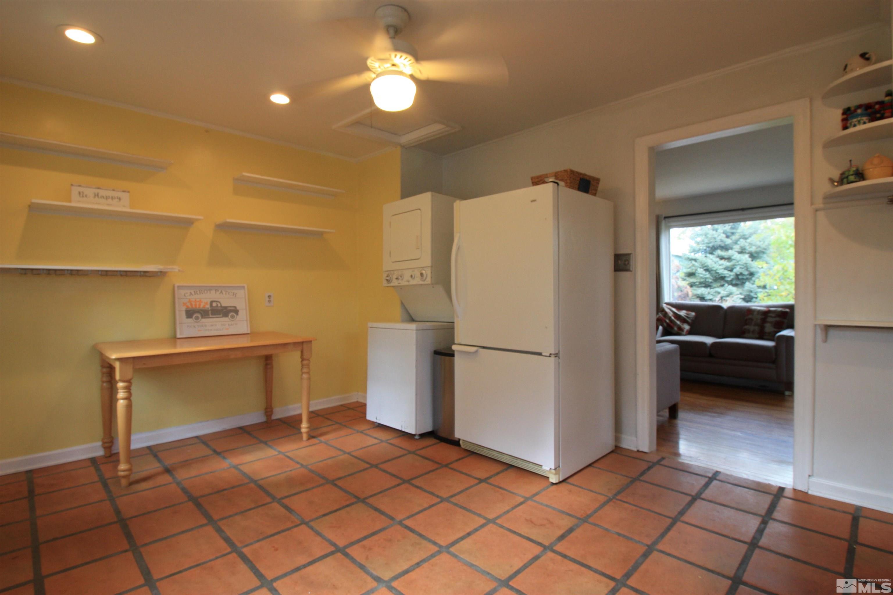 540 Toiyabe Street Reno, NV 89509 - Photo 9 of 29 a white refrigerator freezer sitting inside of a kitchen