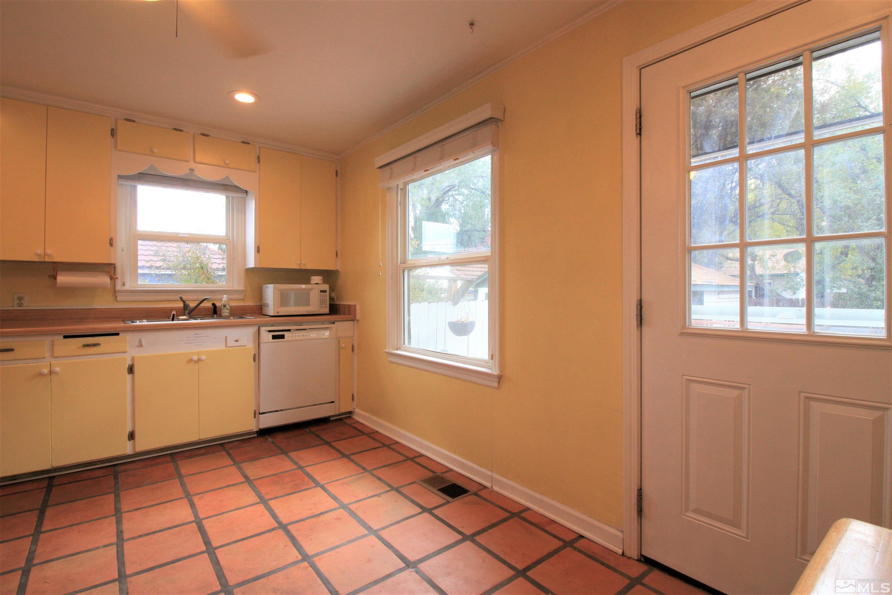 540 Toiyabe Street Reno, NV 89509 - Photo 10 of 29 a kitchen with a sink window and cabinets