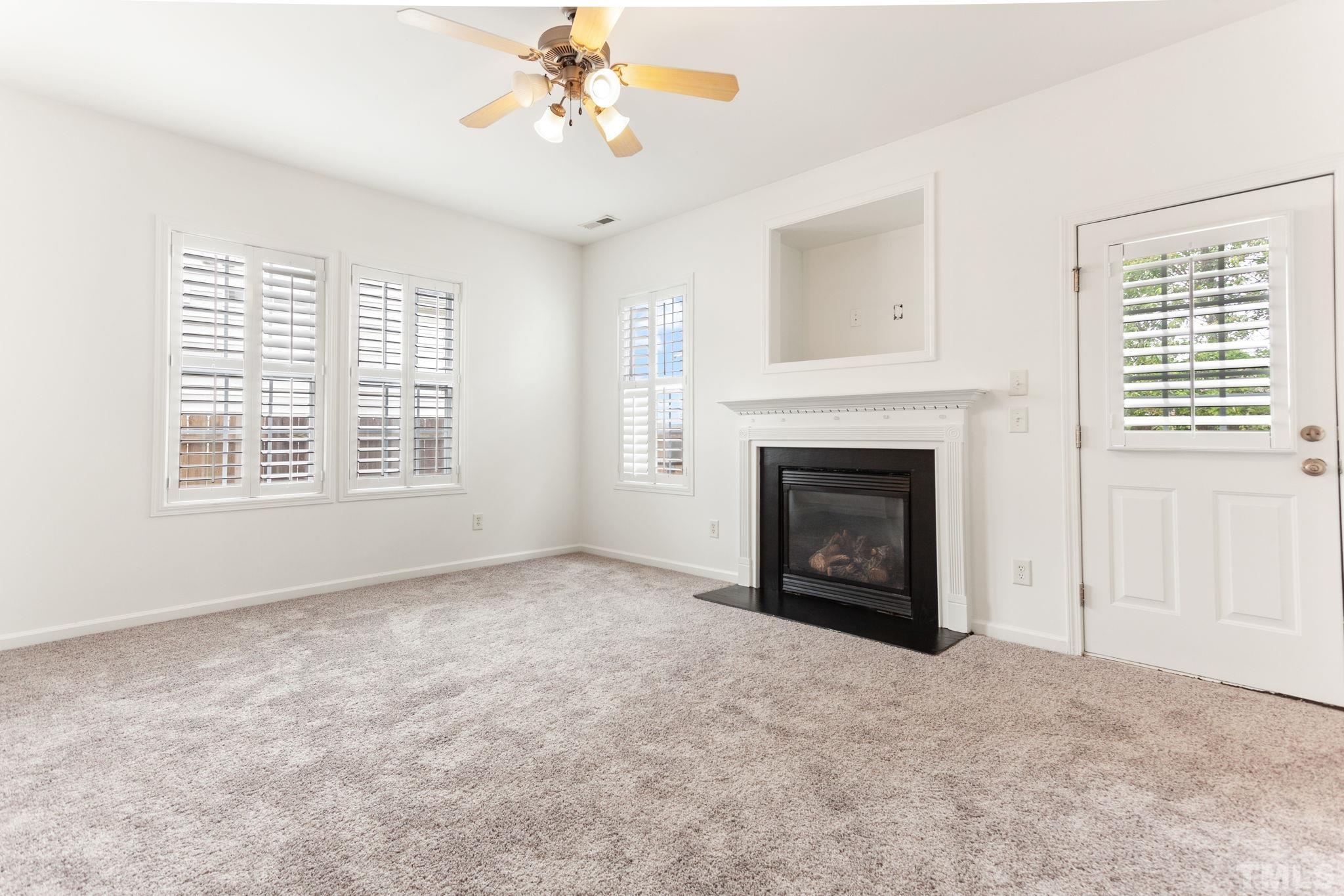 6810 Spanglers Spring Way Raleigh, NC 27610 - Photo 3 of 24 a view of an empty room with a window