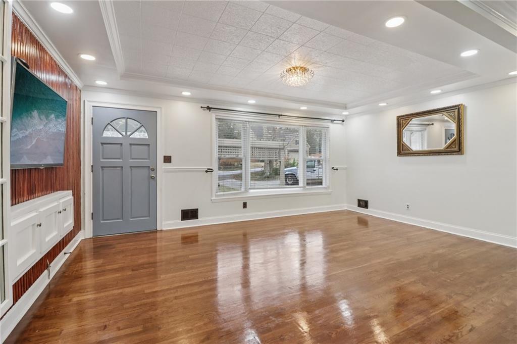 716 Carolina Road Marietta, GA 30008 - Photo 13 of 71 a view of empty room with wooden floor and window