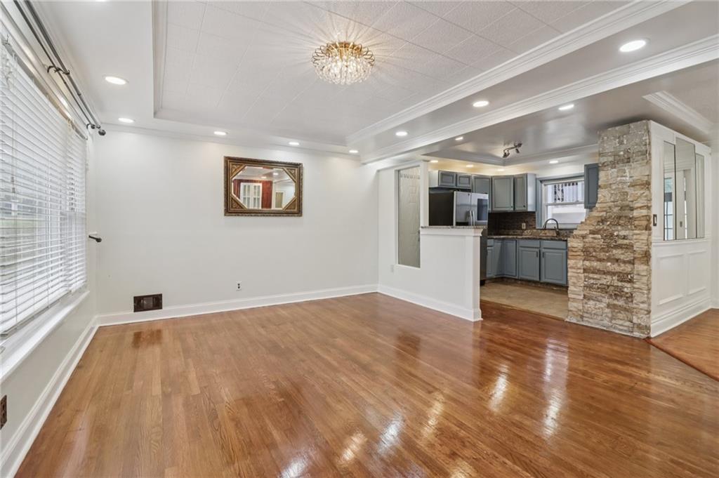 716 Carolina Road Marietta, GA 30008 - Photo 15 of 71 a view of an empty room with kitchen and a window