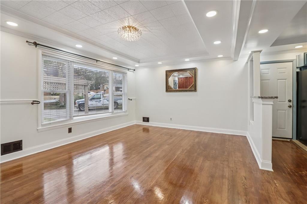 716 Carolina Road Marietta, GA 30008 - Photo 16 of 71 a view of empty room with wooden floor and fan