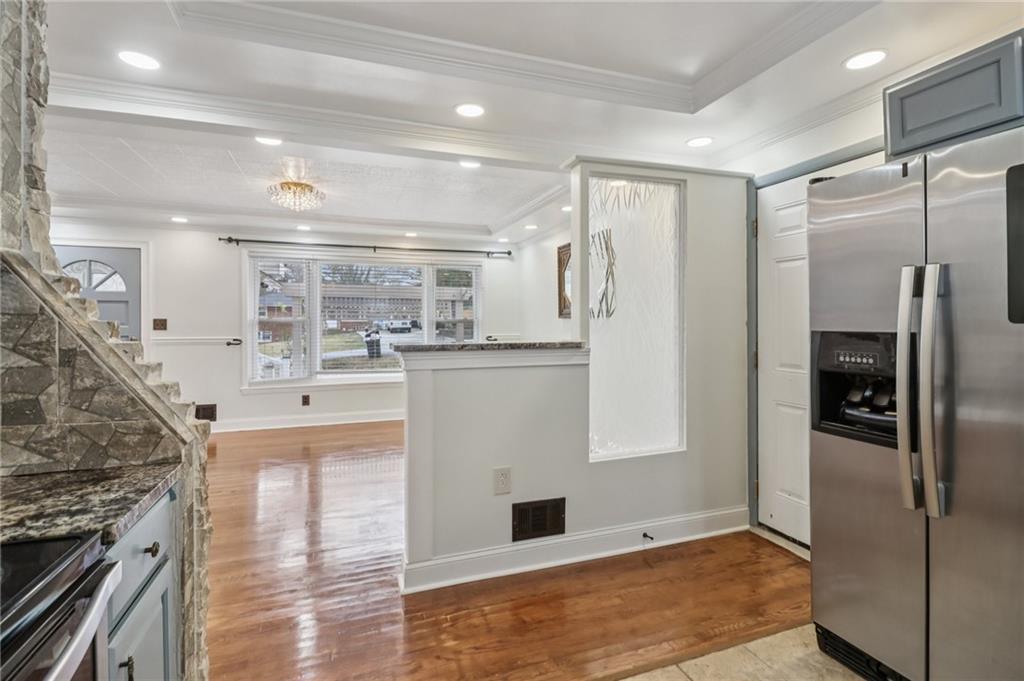 716 Carolina Road Marietta, GA 30008 - Photo 23 of 71 a kitchen with stainless steel appliances granite countertop a refrigerator and a stove