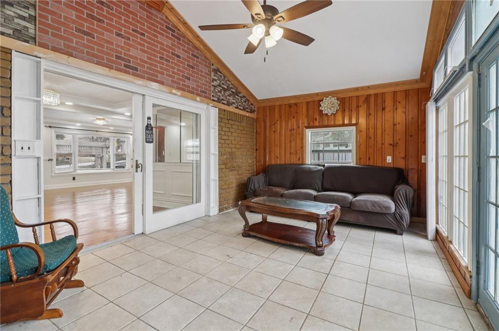 716 Carolina Road Marietta, GA 30008 - Photo 28 of 71 a living room with furniture and a chandelier