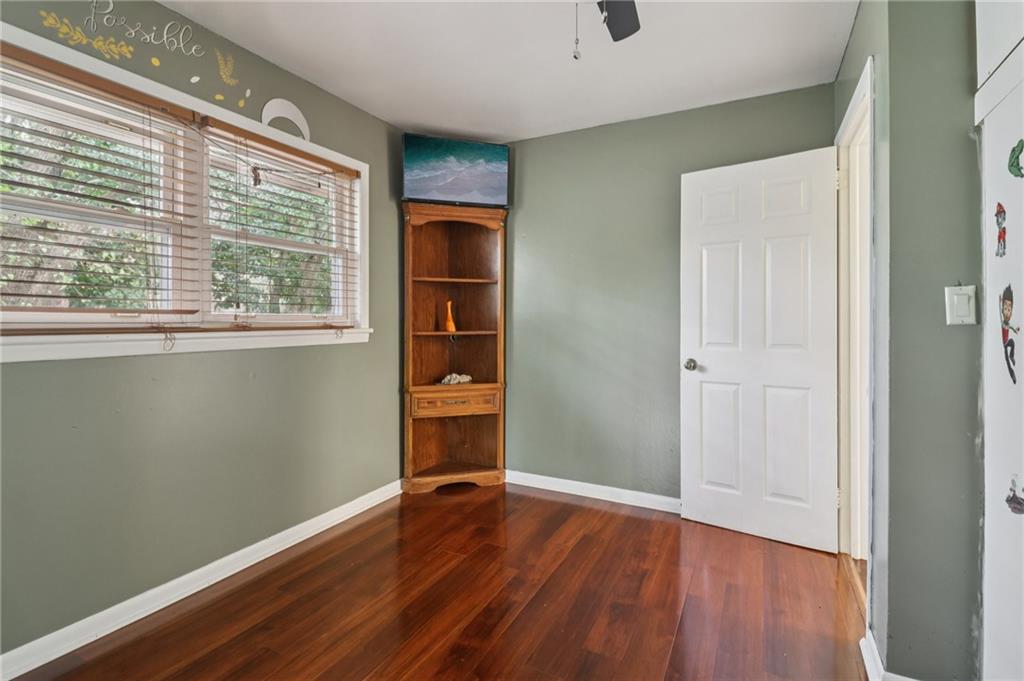 716 Carolina Road Marietta, GA 30008 - Photo 32 of 71 a view of an empty room with wooden floor and a window