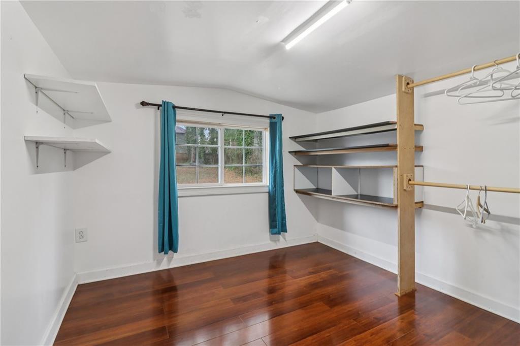 716 Carolina Road Marietta, GA 30008 - Photo 35 of 71 a view of an empty room with wooden floor and a window