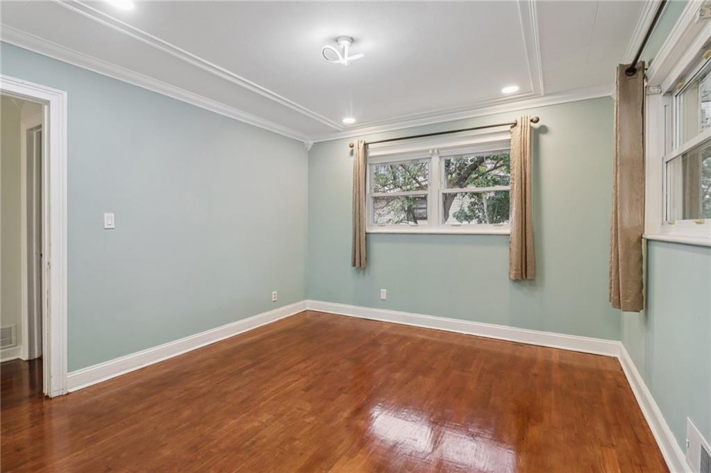 716 Carolina Road Marietta, GA 30008 - Photo 41 of 71 an empty room with wooden floor and windows